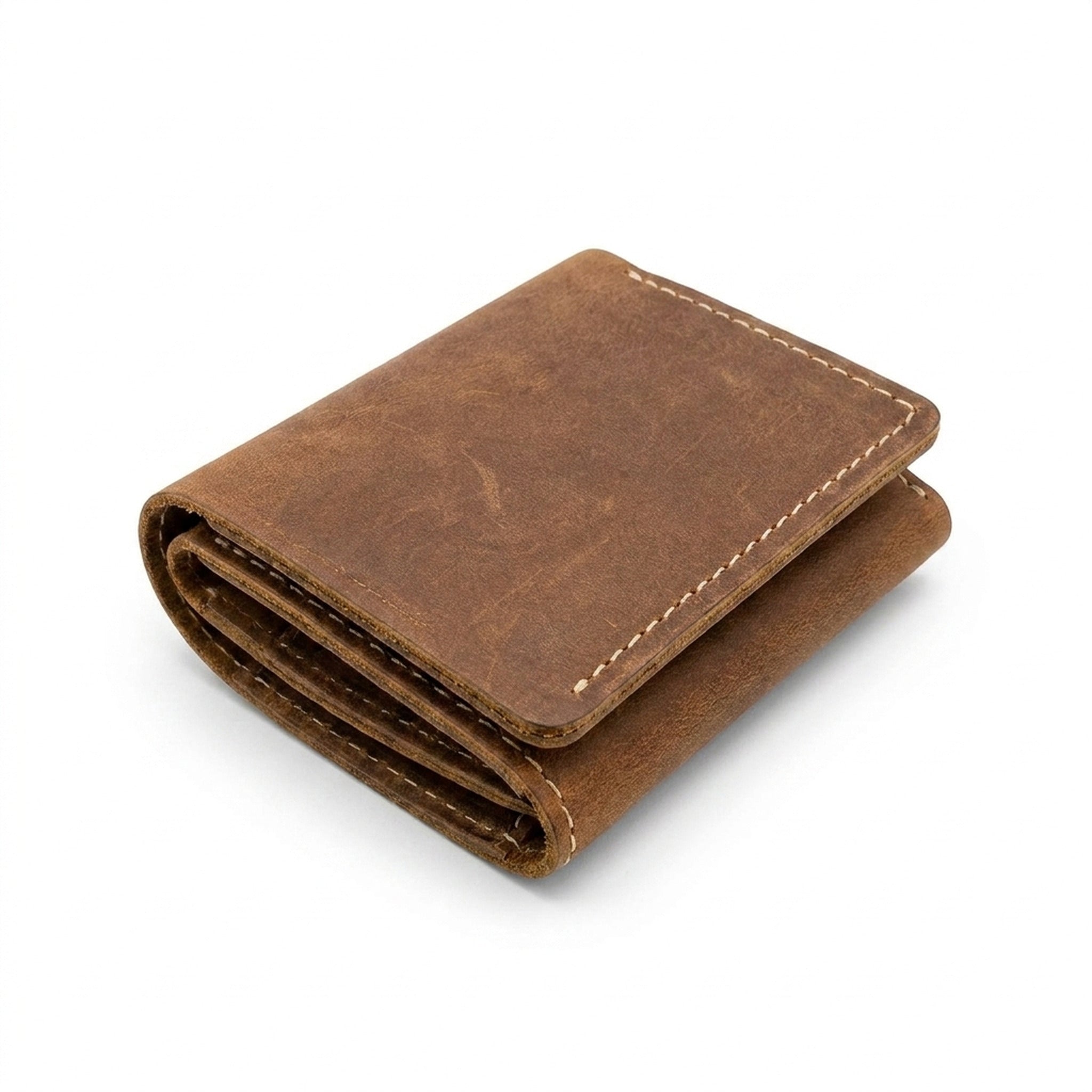 The Drifter folded closed, a compact brown Crazy Horse trifold with cream stitching