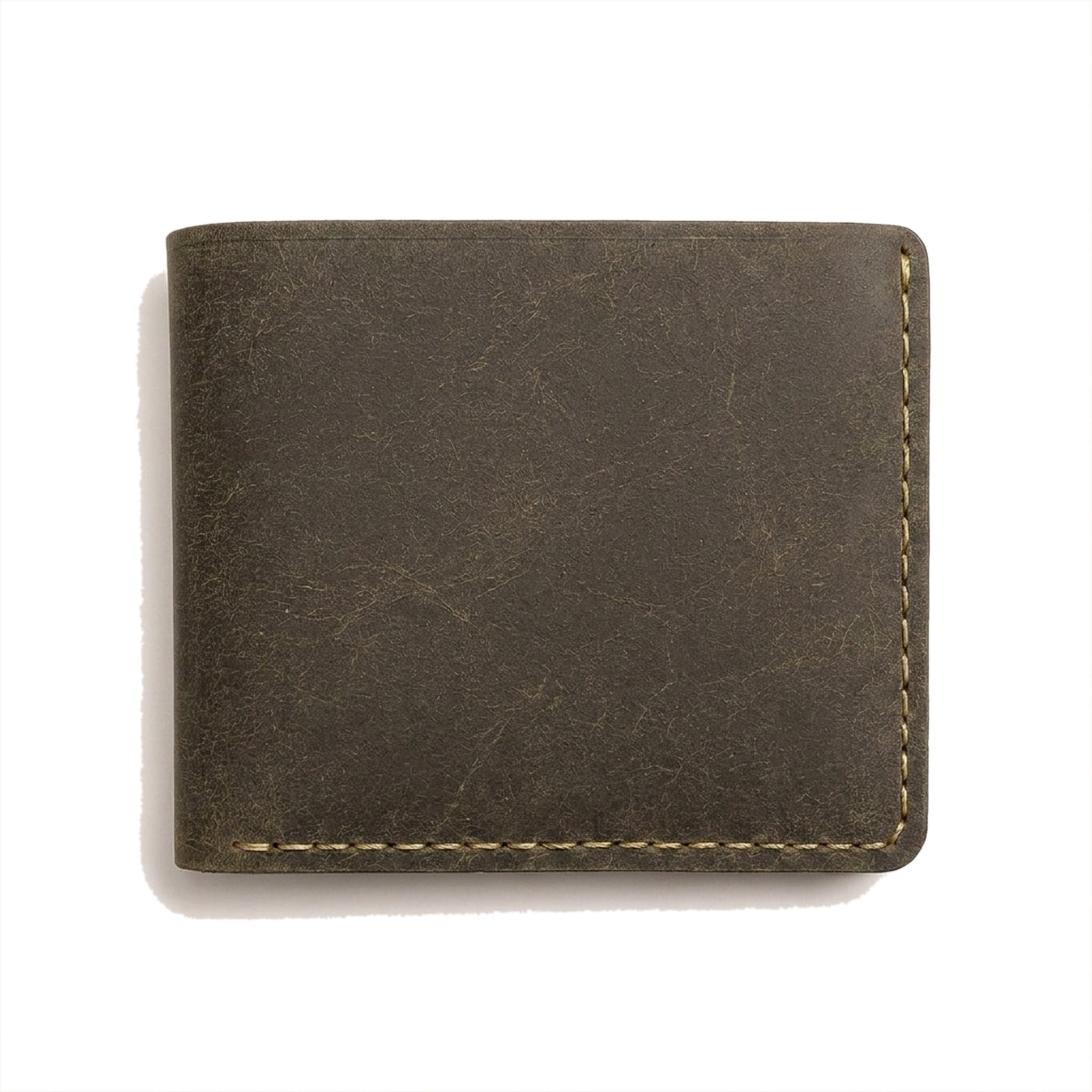 The Purser folded closed in olive-brown Crazy Horse leather with pale contrast stitching