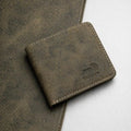 The Ranger bifold wallet in distressed olive Crazy Horse leather with cream stitching and an RFID stamp